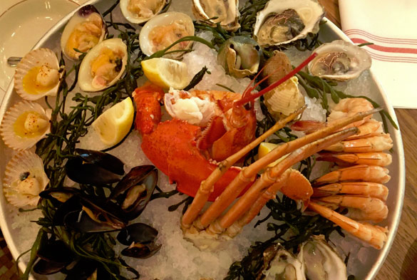 Sip champagne and sample fresh oysters at Le Zoo in the Bal Harbour Shops