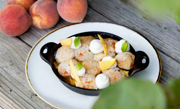 Executive Pastry Chef Jill Montinola's summery Peach Cobbler is easy to DIY at home
