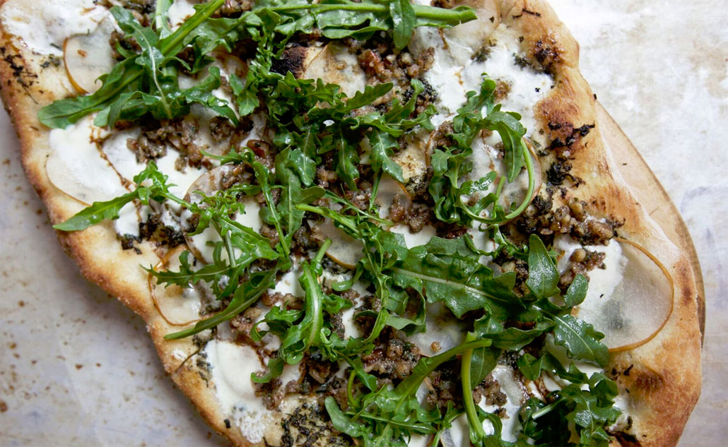 Upland's Pear Pizza topped with Baby Arugula