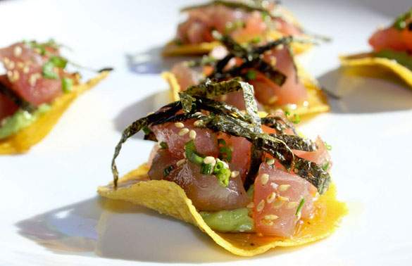 Flavorful crisps topped with Tuna Poke, avocado, nori and sesame seeds